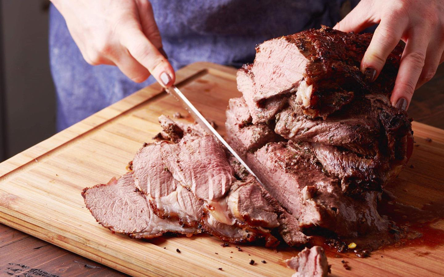 image of roast beef being carved by a knife