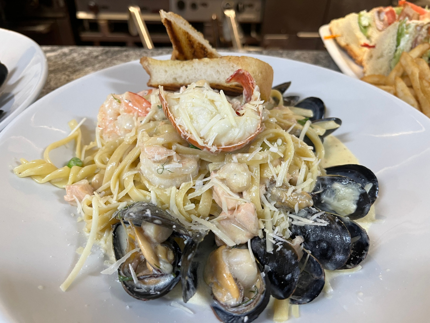 plate of seafood pasta with shrimp and mussels